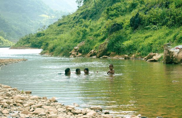 Wading in the stream in Thien Huong Village