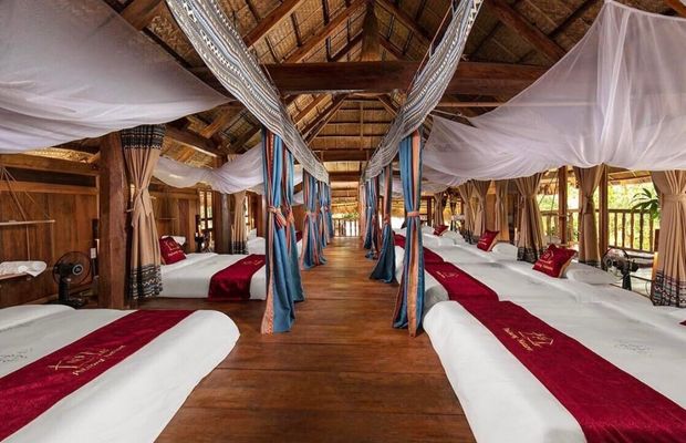 Double beds inside Pu Luong Natura's stilt house