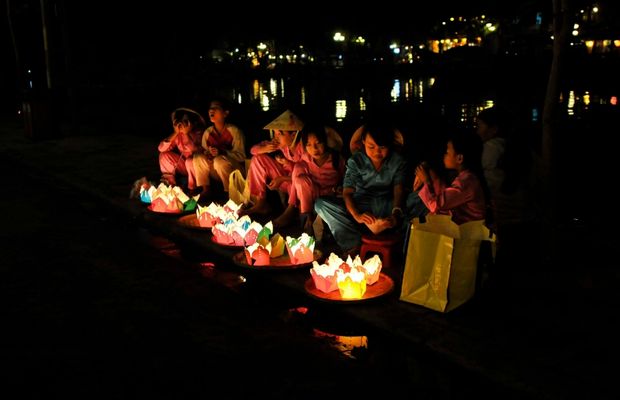Releasing flower lanterns on the Hoai River