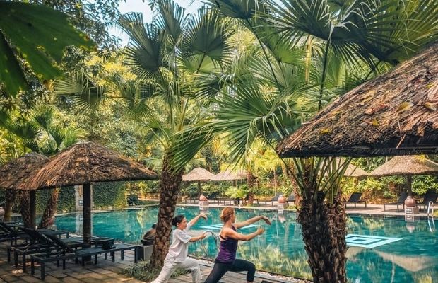 Doing yoga in Pilgrimage Village Hue