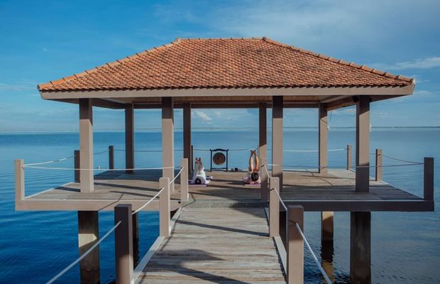 Morning yoga class at Vedana Lagoon Resort & Spa